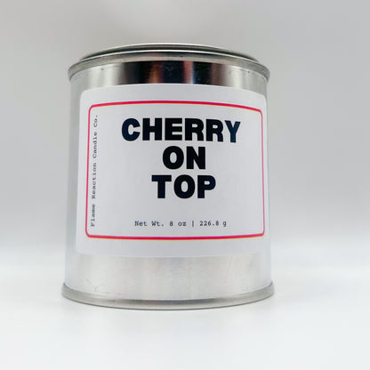 Candle tin labeled 'Cherry on Top' on a white background